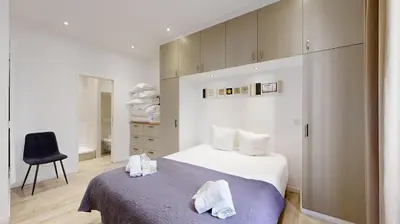 Un ou plusieurs lits dans un hébergement de l'établissement Bluestay 1 - Appartement au Cœur de Paris