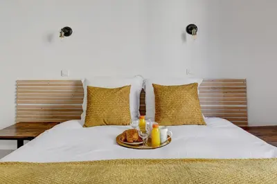 Un ou plusieurs lits dans un hébergement de l'établissement Bluestay 127 - Supebe Appartement au Cœur de Paris