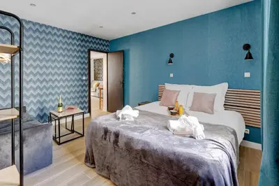 Un ou plusieurs lits dans un hébergement de l'établissement Bluestay 127 - Supebe Appartement au Cœur de Paris