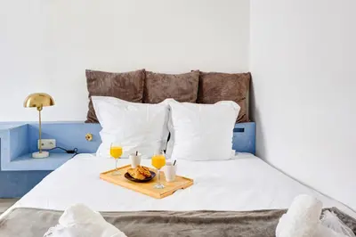 Un ou plusieurs lits dans un hébergement de l'établissement Bluestay 222 - Appartement au centre de Paris