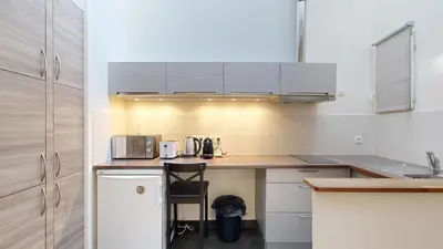 Cuisine ou kitchenette dans l'établissement Bluestay 131 - Charmant appartement à Paris