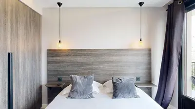 Un ou plusieurs lits dans un hébergement de l'établissement Bluestay 54 - Superbe appartement à Paris