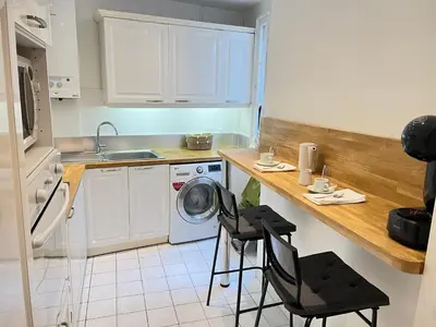 Cuisine ou kitchenette dans l'établissement Colisee