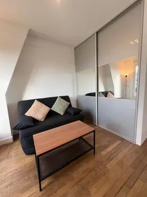 Coin salon dans l'établissement Studio confortable proche Paris