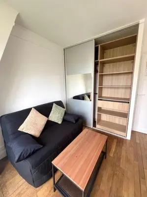 Coin salon dans l'établissement Studio confortable proche Paris