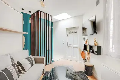 Télévision ou salle de divertissement dans l'établissement Cosy Apt - 2P - République - Marais