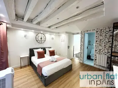 Un ou plusieurs lits dans un hébergement de l'établissement Urban Flat 179 - Pretty Loft Montorgueil