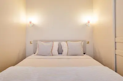 Un ou plusieurs lits dans un hébergement de l'établissement Appartement lumineux Marais 2 chambres