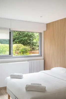 Un ou plusieurs lits dans un hébergement de l'établissement Appartement Climatisé Porte Versailles
