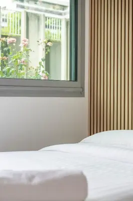 Un ou plusieurs lits dans un hébergement de l'établissement Appartement Climatisé Porte Versailles