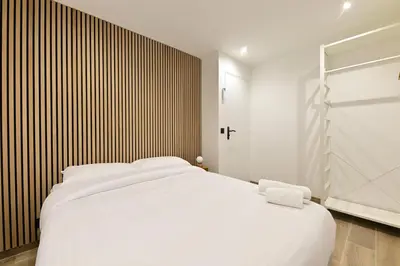 Un ou plusieurs lits dans un hébergement de l'établissement Appartement Climatisé Porte Versailles
