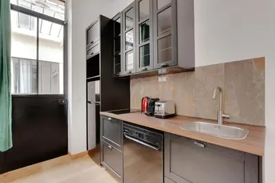Cuisine ou kitchenette dans l'établissement Pick A Flat's Apartments in Montmartre - Rue des Cottages