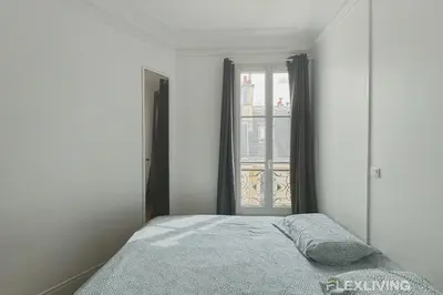 Un ou plusieurs lits dans un hébergement de l'établissement Flexliving - room - Lemoine