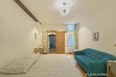 Un ou plusieurs lits dans un hébergement de l'établissement Flexliving - studio - Lemoine