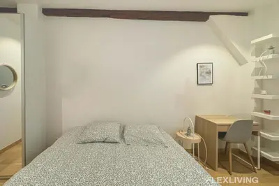 Un ou plusieurs lits dans un hébergement de l'établissement Flexliving - studio - Lemoine
