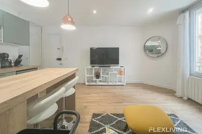 Télévision ou salle de divertissement dans l'établissement Flexliving - T2 - Garibaldi