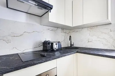 Cuisine ou kitchenette dans l'établissement Pick A Flat's Apartment in Sentier-Montorgueil - Rue du Nil