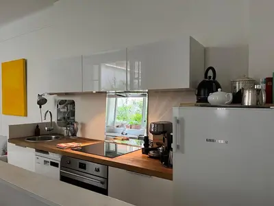 Cuisine ou kitchenette dans l'établissement Comme une petite maison