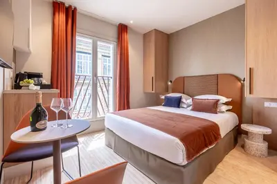 Un ou plusieurs lits dans un hébergement de l'établissement Suites FL By Sweett