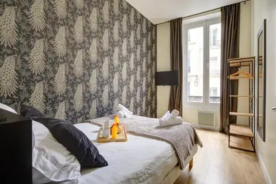 Un ou plusieurs lits dans un hébergement de l'établissement Bluestay 47 - Appartement au cœur de Paris