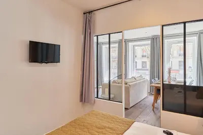 Un ou plusieurs lits dans un hébergement de l'établissement Apartment 2 bedrooms Center of Paris