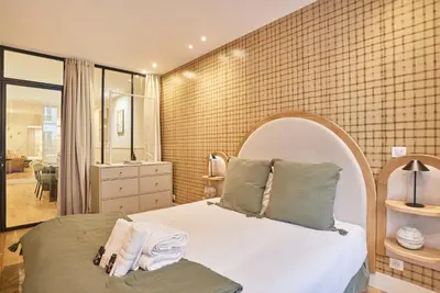 Un ou plusieurs lits dans un hébergement de l'établissement Charming flat in the heart of Paris