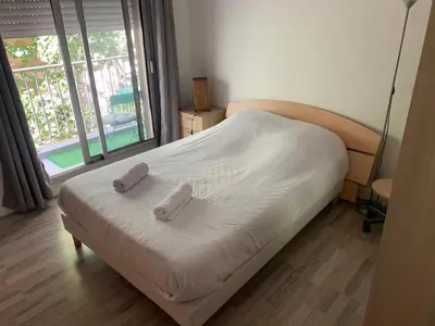 Un ou plusieurs lits dans un hébergement de l'établissement Cosy family flat
