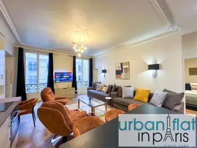 Coin salon dans l'établissement Urban Flat 63 - Beautiful 3 Bedroom Flat Champs-Elysees