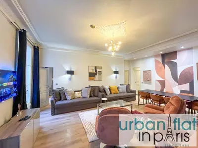 Coin salon dans l'établissement Urban Flat 63 - Beautiful 3 Bedroom Flat Champs-Elysees