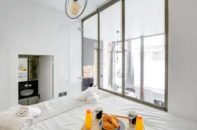 Un ou plusieurs lits dans un hébergement de l'établissement Bluestay 150 - Charmant appartement à Paris