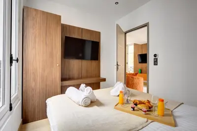 Un ou plusieurs lits dans un hébergement de l'établissement Bluestay 292 - Superbe appartement à Paris 17