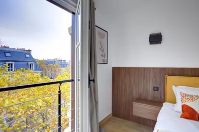 Un ou plusieurs lits dans un hébergement de l'établissement Bluestay 296 - Superbe appartement à Paris 17