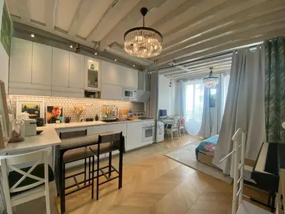 Cuisine ou kitchenette dans l'établissement Appartement cosy à Saint Michel-Notre Dame Paris Center