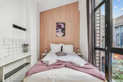 Un ou plusieurs lits dans un hébergement de l'établissement Lofts Chemin Vert