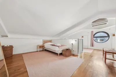Un ou plusieurs lits dans un hébergement de l'établissement Lofts Chemin Vert