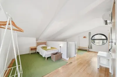 Un ou plusieurs lits dans un hébergement de l'établissement Lofts Chemin Vert