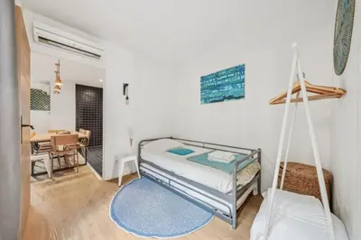 Un ou plusieurs lits dans un hébergement de l'établissement Lofts Chemin Vert