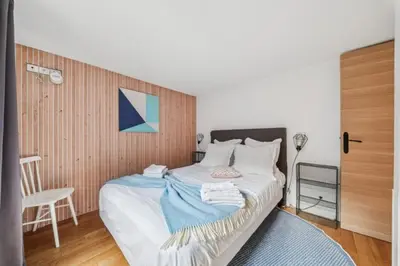 Un ou plusieurs lits dans un hébergement de l'établissement Lofts Chemin Vert
