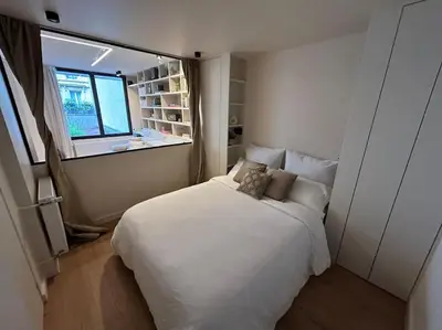 Un ou plusieurs lits dans un hébergement de l'établissement Le Cocon des Sablons - Tour Eiffel Champs Elysées