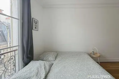 Un ou plusieurs lits dans un hébergement de l'établissement Flexliving - room - Lemoine