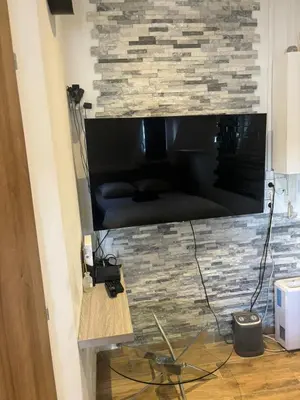 Télévision ou salle de divertissement dans l'établissement Studio avec vue sur Sacré-Coeur