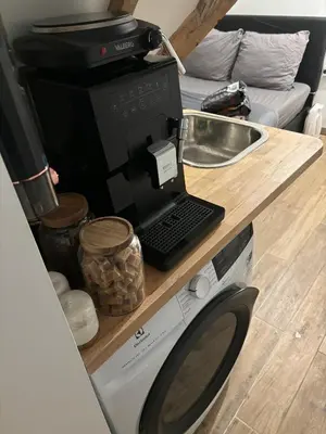 Cuisine ou kitchenette dans l'établissement Petit studio a proximité des Galeries Lafayette