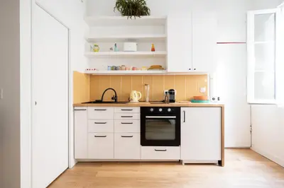 Cuisine ou kitchenette dans l'établissement Studio de Bourgoin - Welkeys