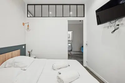 Un ou plusieurs lits dans un hébergement de l'établissement Lavie Maison I Marais & Historic & Central