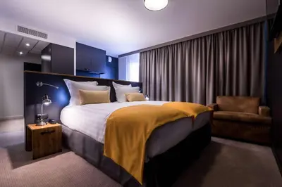 Un ou plusieurs lits dans un hébergement de l'établissement Best Western Plus Suitcase Paris La Défense