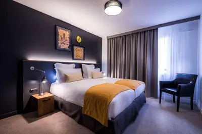 Un ou plusieurs lits dans un hébergement de l'établissement Best Western Plus Suitcase Paris La Défense
