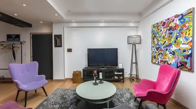 Télévision ou salle de divertissement dans l'établissement 3-bedroom apartment Quai des Grands Augustins