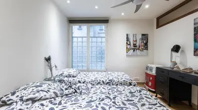 Un ou plusieurs lits dans un hébergement de l'établissement 3-bedroom apartment Quai des Grands Augustins