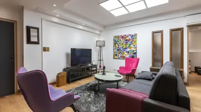 Télévision ou salle de divertissement dans l'établissement 3-bedroom apartment Quai des Grands Augustins