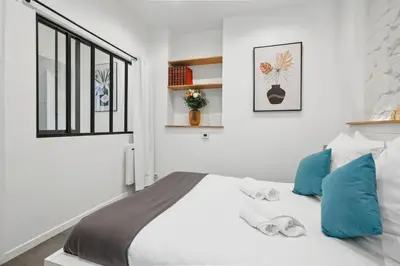 Un ou plusieurs lits dans un hébergement de l'établissement Lavie Maison I Marais Family with terrace